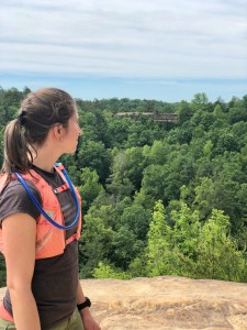 Rebekah with Natural Bridge in the distance. Photo by Curt Whitacre.
